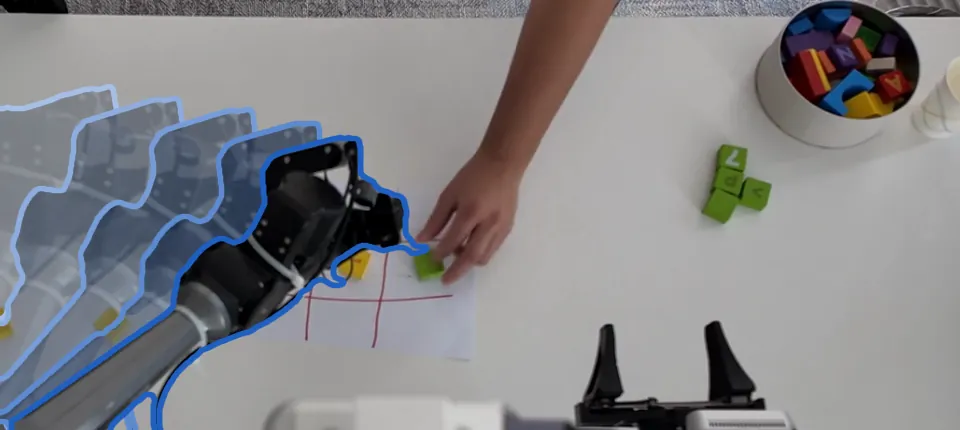 An AgileX robot arm places a block on a tic-tac-toe grid while a person places a green block; fading outlines trace the arm's earlier poses.